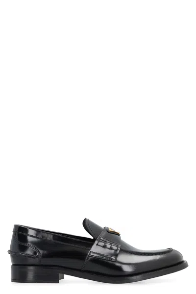 Prada Leather Loafers With Decorative Buckle And Round Toe In Black