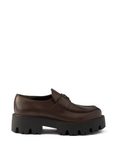 Prada Stride Leather Penny Loafers In Brown