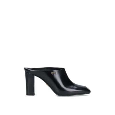 Prada Leather Logo Mules In Black