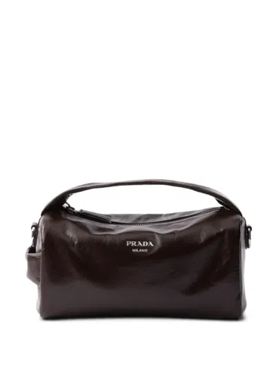 Prada Stamped Logo Glossy Leather Messenger Bag In Black