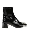 Prada Triangle Logo Plaque Boots In Black
