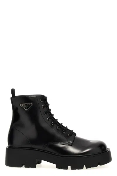 Prada Logo Brushed Leather Ankle Boots In Black