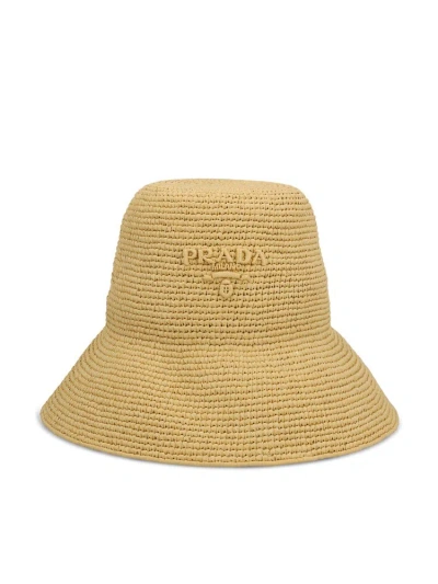 Prada Logo Embossed Bucket Hat In Beige