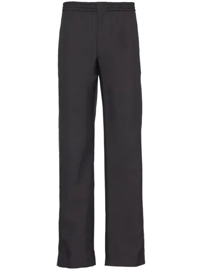 Prada Logo-embroidered Silk Trousers In Black