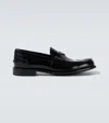 Prada Triangular Plaque Loafers In Black