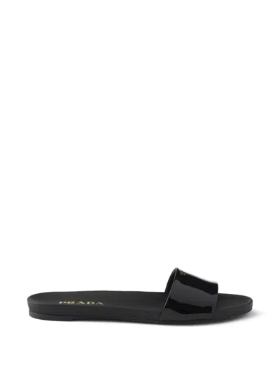 Prada Logo Patent Leather Slides In Black
