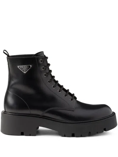 Prada Logo Plaque Leather Combat Boots In Schwarz