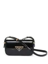 Prada Logo Plaque Patent Leather Shoulder Bag In Black