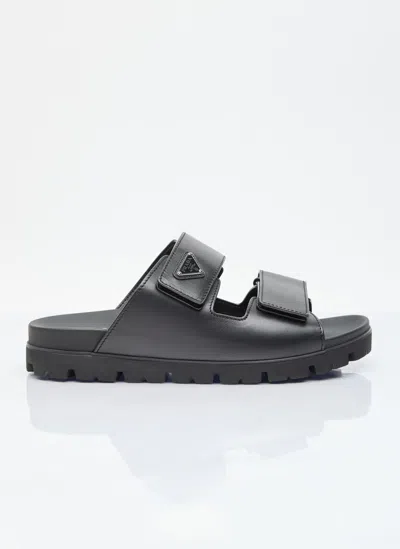 Prada Logo Plaque Leather Slides In Black