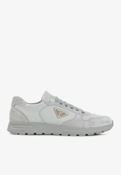 PRADA LOGO-PLAQUE LOW-TOP SNEAKERS