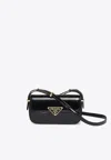 Prada Logo Plaque Patent Leather Shoulder Bag In Black
