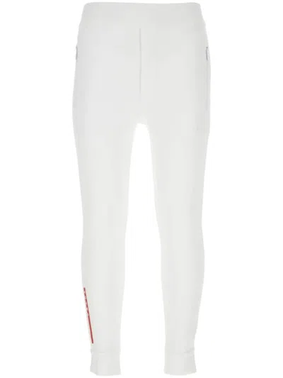 PRADA LOGO-PRINT SKINNY TROUSERS
