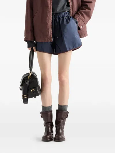 Prada Re-nylon Shorts In Blue