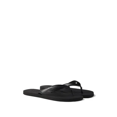PRADA LOGO-EMBOSSED LEATHER FLIP-FLOP SANDALS