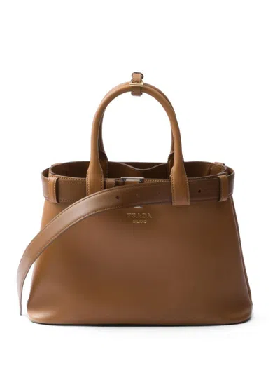 Prada Medium Logo Leather Top Handle Bag In Brown