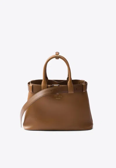 Prada Medium Logo Leather Top Handle Bag In Brown