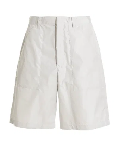 PRADA PRADA MID-RISE LOGO PLAQUE FLARED SHORTS