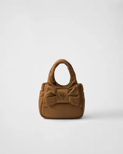 Prada Mini Padded Re-nylon Bag With Bow In Brown