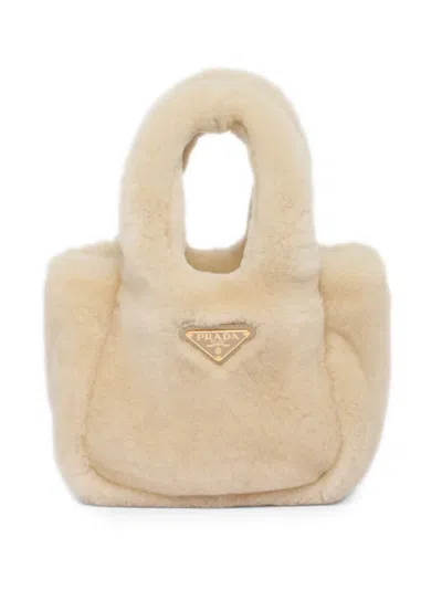 Prada Mini Triangle-logo Shearling Tote Bag In Neutrals