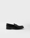 Prada Triangular Plaque Loafers In Black