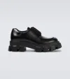 Prada Monolith Brushed Leather Derby Shoes In Nero