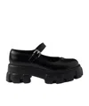 Prada Monolith Glossed-leather Mary Janes In Black