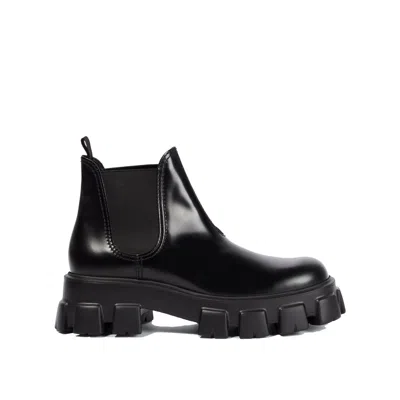 Prada Monolith Leather Ankle Boots In Black