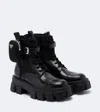 Prada Monolith Leather Ankle Boots In Black