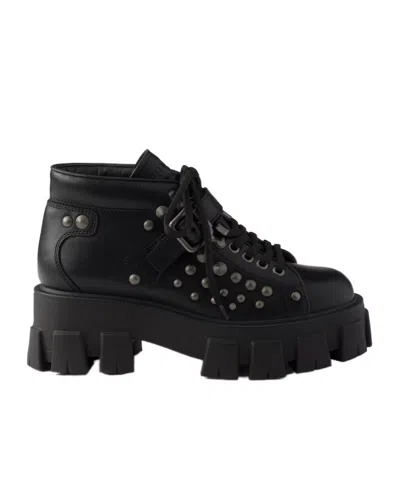 Prada Monolith Studded Leather Booties In Black