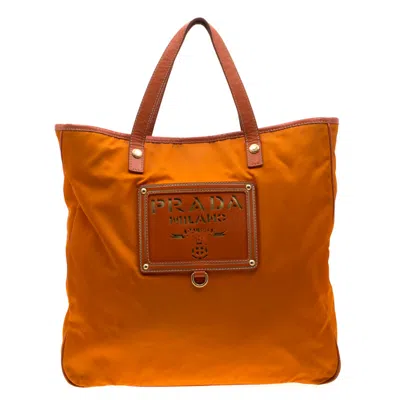 Prada Nylon And Leather Lasercut Logo Tote In Orange