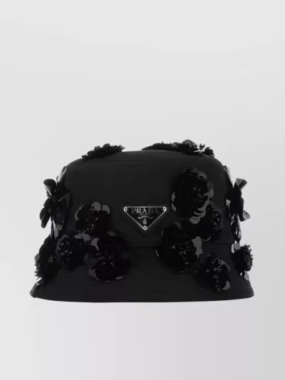Prada Nylon Bucket Hat With Wide Brim And Floral Embellishments In Black