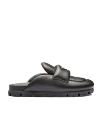 Prada Padded Leather Sabots In Black