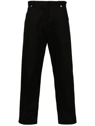 Prada Triangle-logo Tapered Jeans In Black