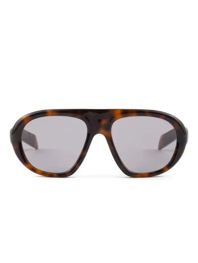 Prada 57mm Irregular Sunglasses In Brown