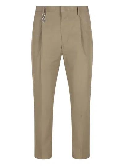 Prada Pleated Cotton Trousers With Charm In Brown