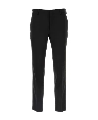 PRADA PRADA TRIANGLE-LOGO TROUSERS