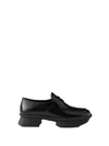 Prada Equal Brushed Leather Loafers In Black