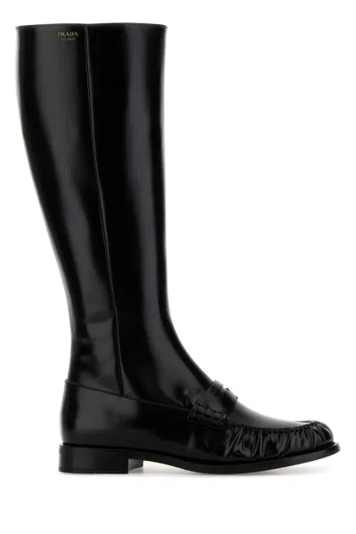 Prada Polished Leather Penny Knee-high Boots In Black