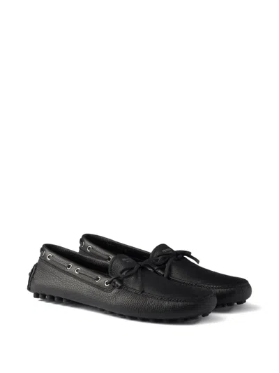 Prada Printed-logo Leather Boat Shoes In Black