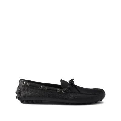 PRADA PRINTED-LOGO LEATHER BOAT SHOES