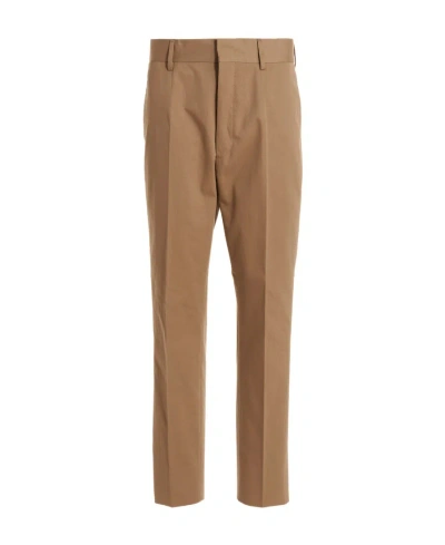 Prada Rear Logo-patch Detail Trousers In Brown