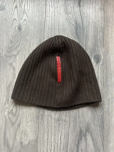 Pre-owned Prada Ribbed Knit Beanie With Red Logo Tab In Brown