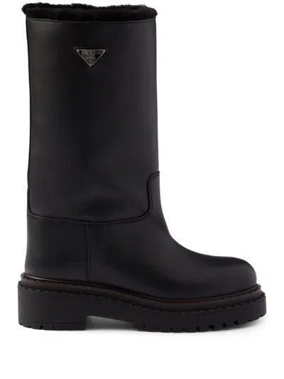 Prada Leather And Shearling Boots In Black