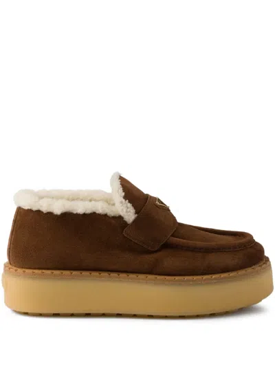 PRADA SHEARLING-TRIMMED PLATFORM LOAFERS