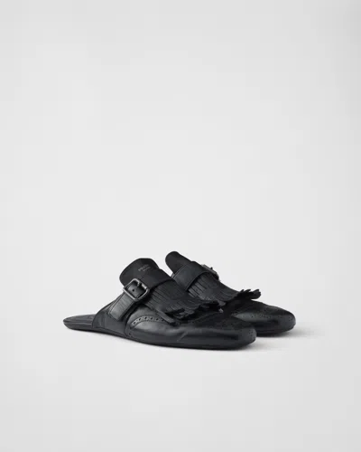 PRADA SHUFFLE MONKSTRAP-MULES AUS LEDER MIT FRANSEN