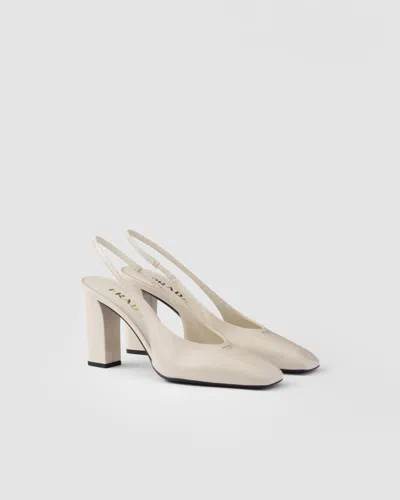 Prada 85 Patent Leather Slingback Pumps In White