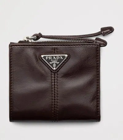 Prada Small Leather Zipped Wallet In Brown