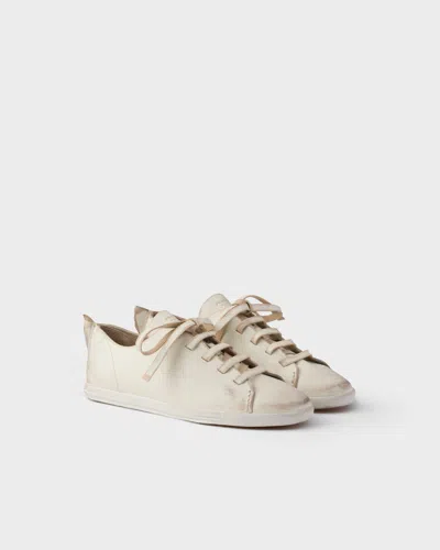 PRADA ANTIQUED LEATHER SNEAKERS