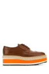 Prada Spazzolato Re-edition Platform Wingtip Loafers In Brown