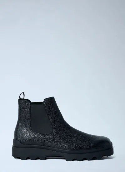 Prada Stamped Leather Boots In Black
